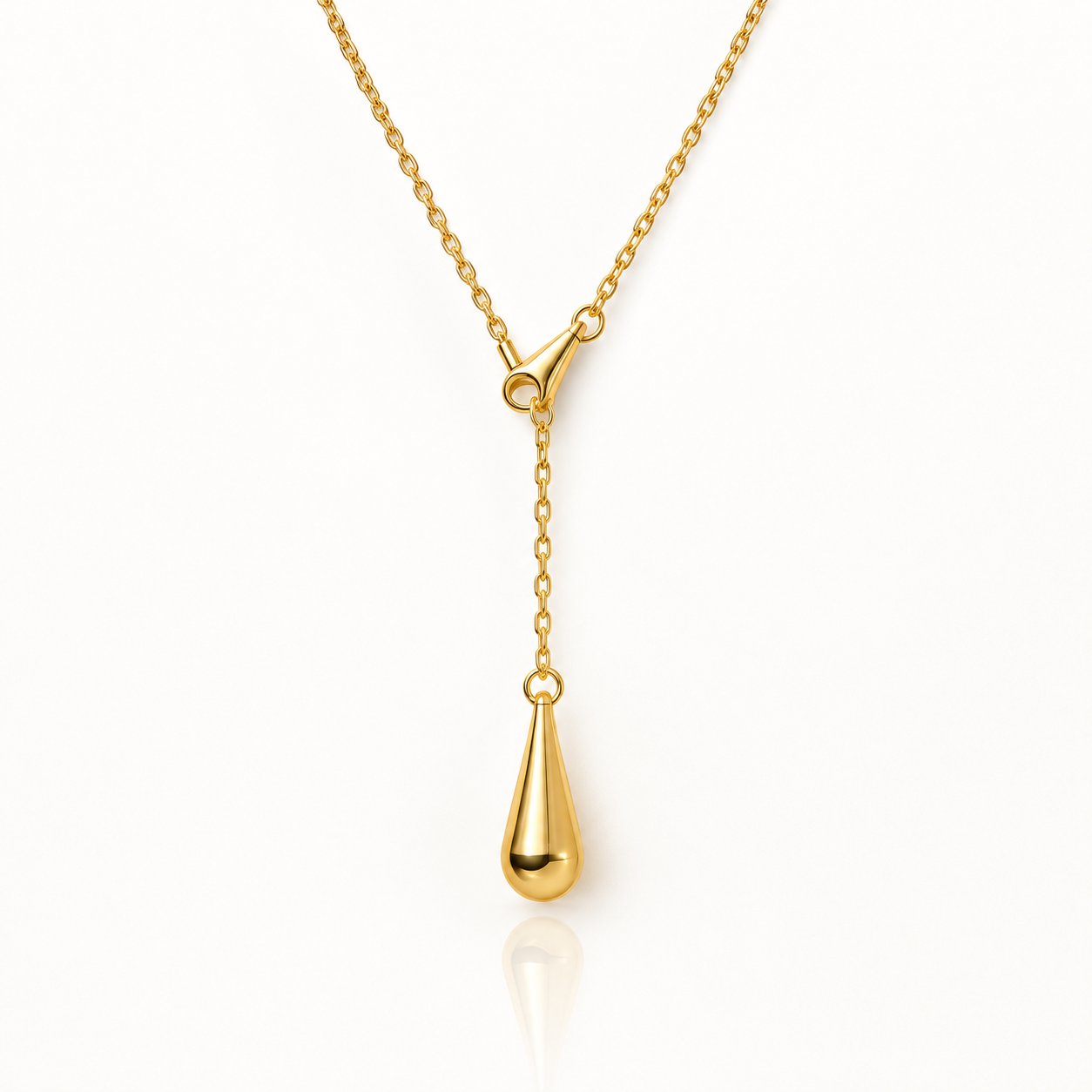 Golden Dew Lariat Necklace in 18K gold plated stainless steel, featuring a fine cable chain gathered through a tapered cone into a Y-shape, ending in a smooth, polished teardrop pendant, shown on a white background.